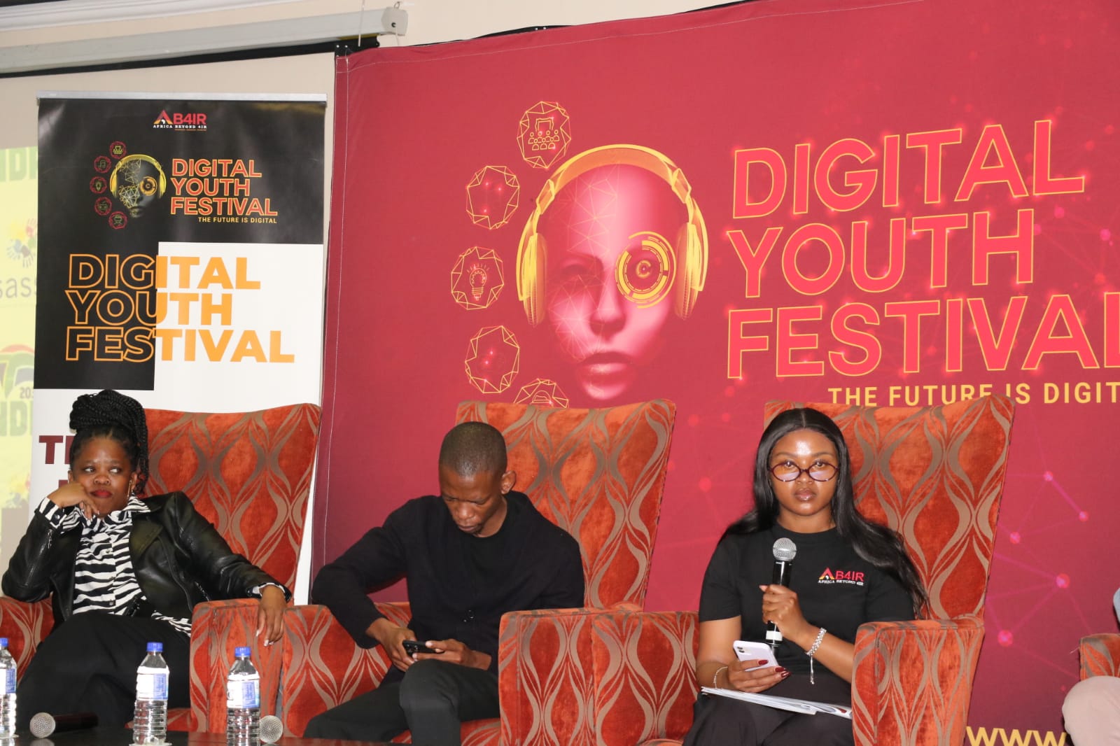Digital Youth Festival speakers on the branded stage